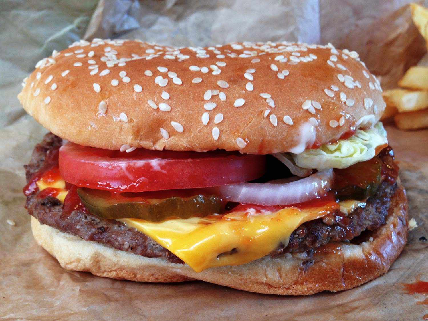 A Whopper resting on its wrapper.