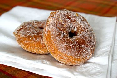 Two Gluten-Free Pumpkin Doughnuts arranged on a napkin.