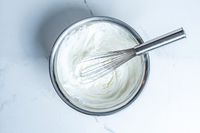 Winco Stainless Steel Piano Wire Whip in a bowl