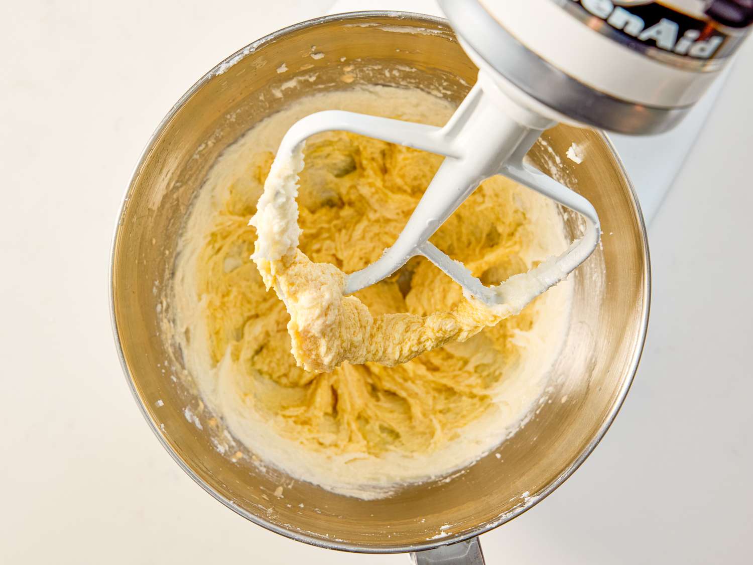 Mixing cookie dough in a stand mixer bowl with a paddle attachment