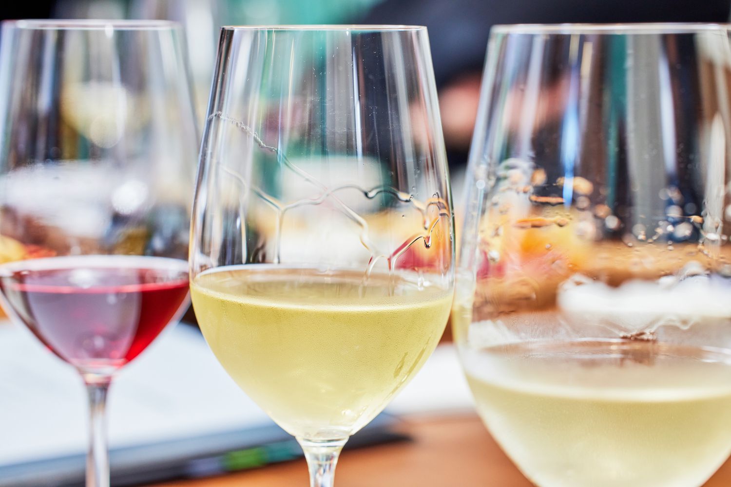 Three Riedel VINUM Zinfandel/Riesling/Chianti Glasses containing red and white wines