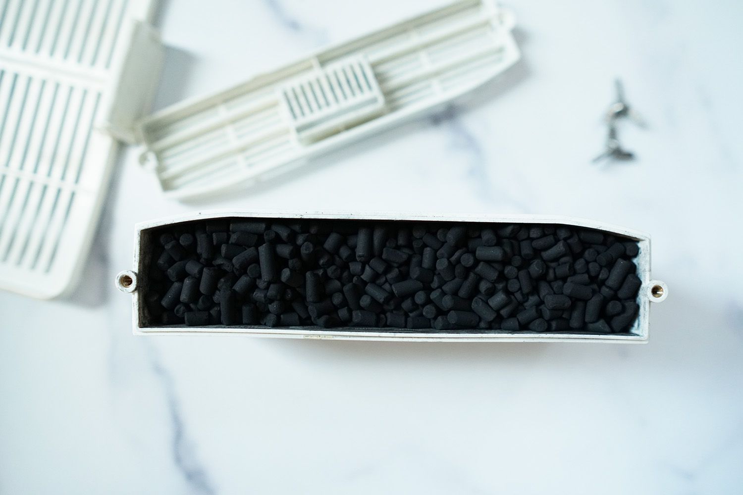 A look at a activated charcoal insert from the Lomi