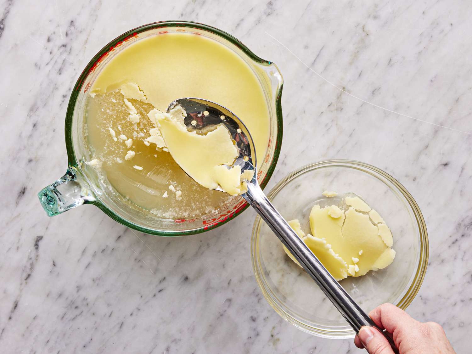 Overhead view of removed solid fat off the top of cooled bone broth