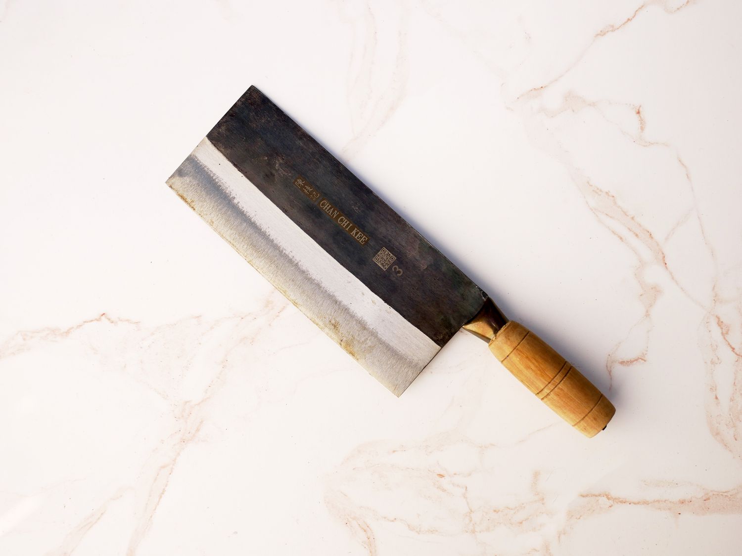 CCK cleaver on pale pink marble surface