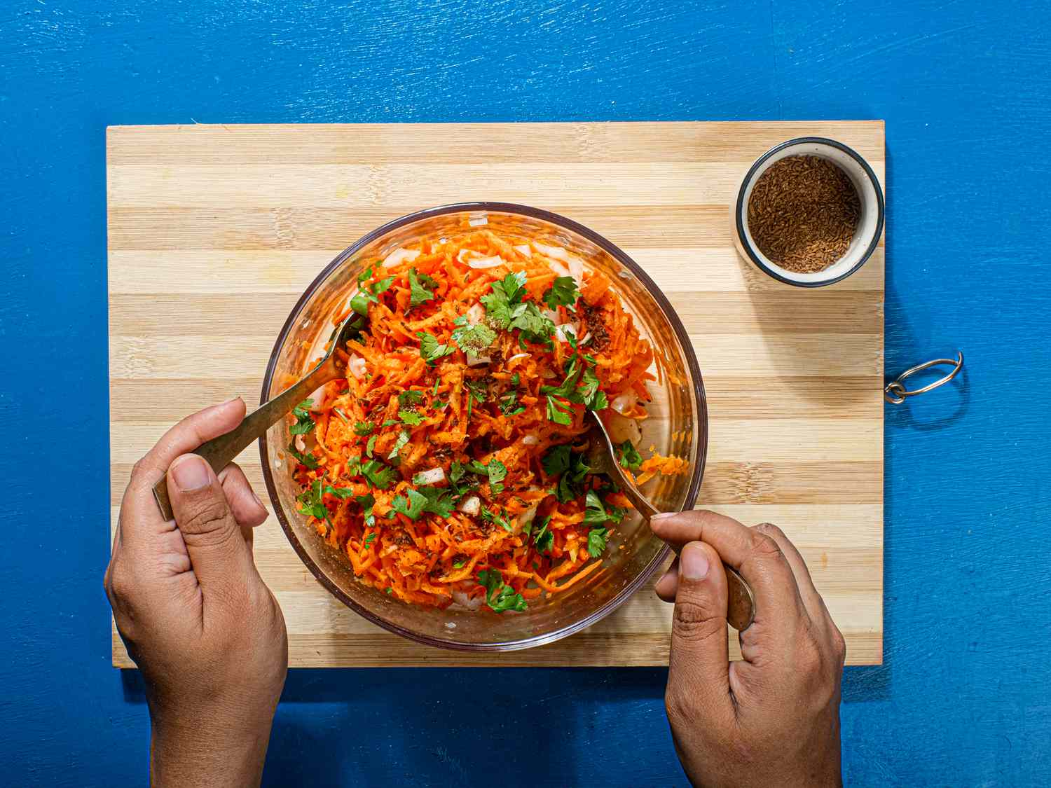 cumin and cilantro are added to the salad.
