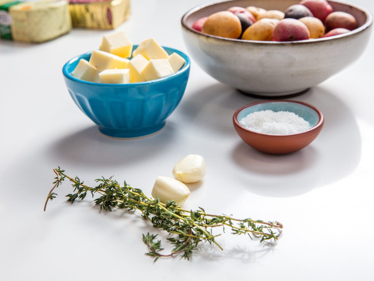 Side view of ingredients for brown butter new potatoes.