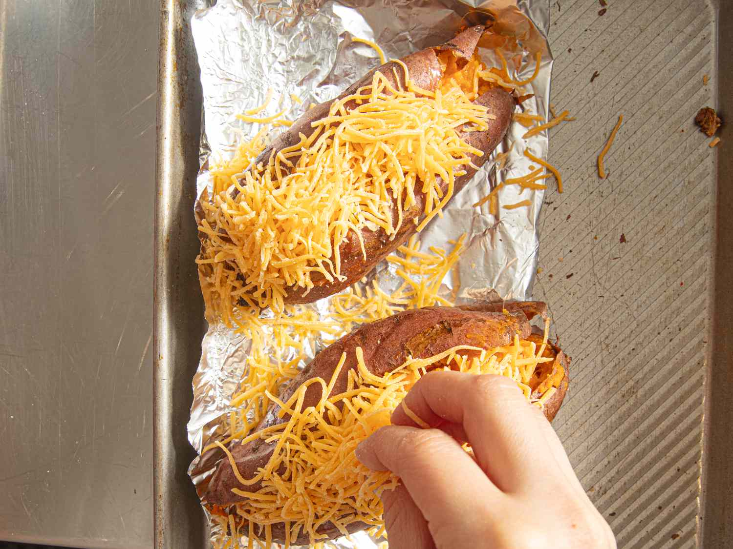 Topping sweet potatoes with cheese