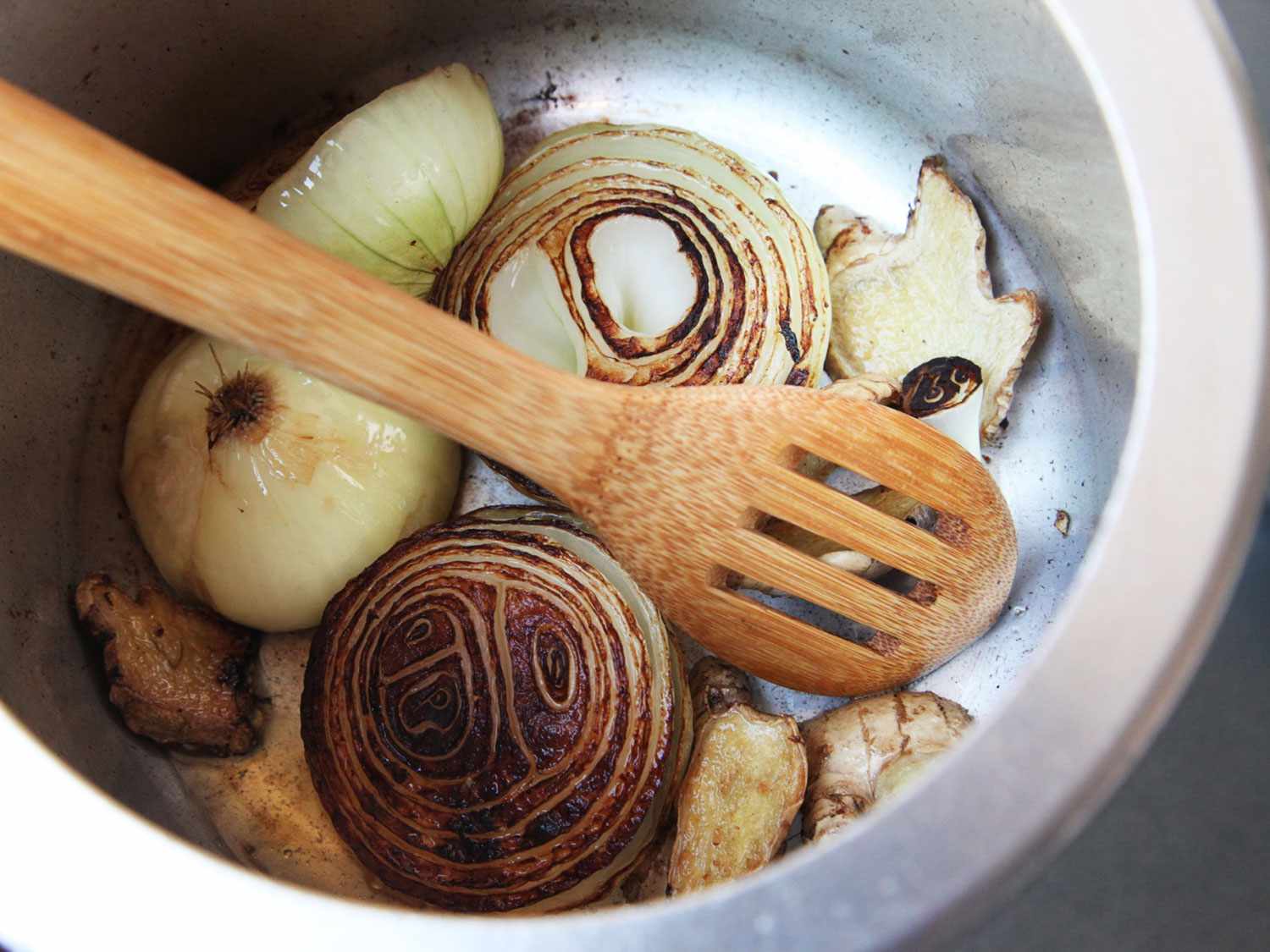 Charring onions and aromatics in a pressure cooker for pho ga.