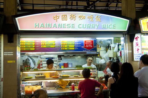Hawker stand selling Hainanese curry rice in Singapore.