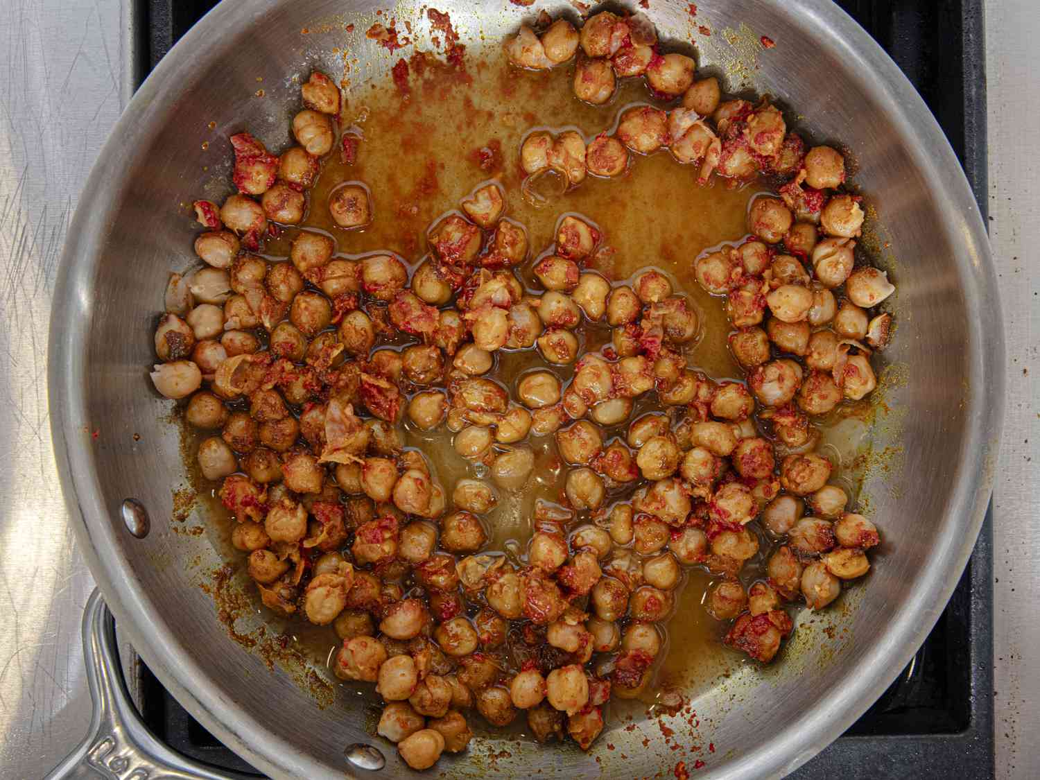 Overhead view of chickpeas and tomato paste