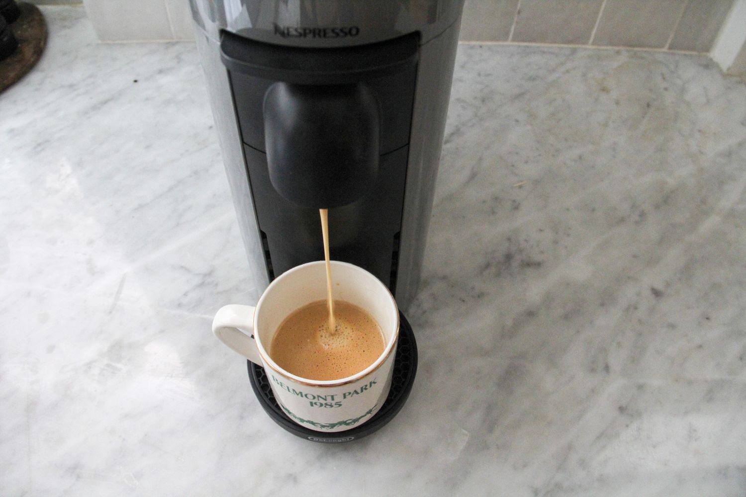 Nespresso Fortado Decaffeinator being poured into a mug