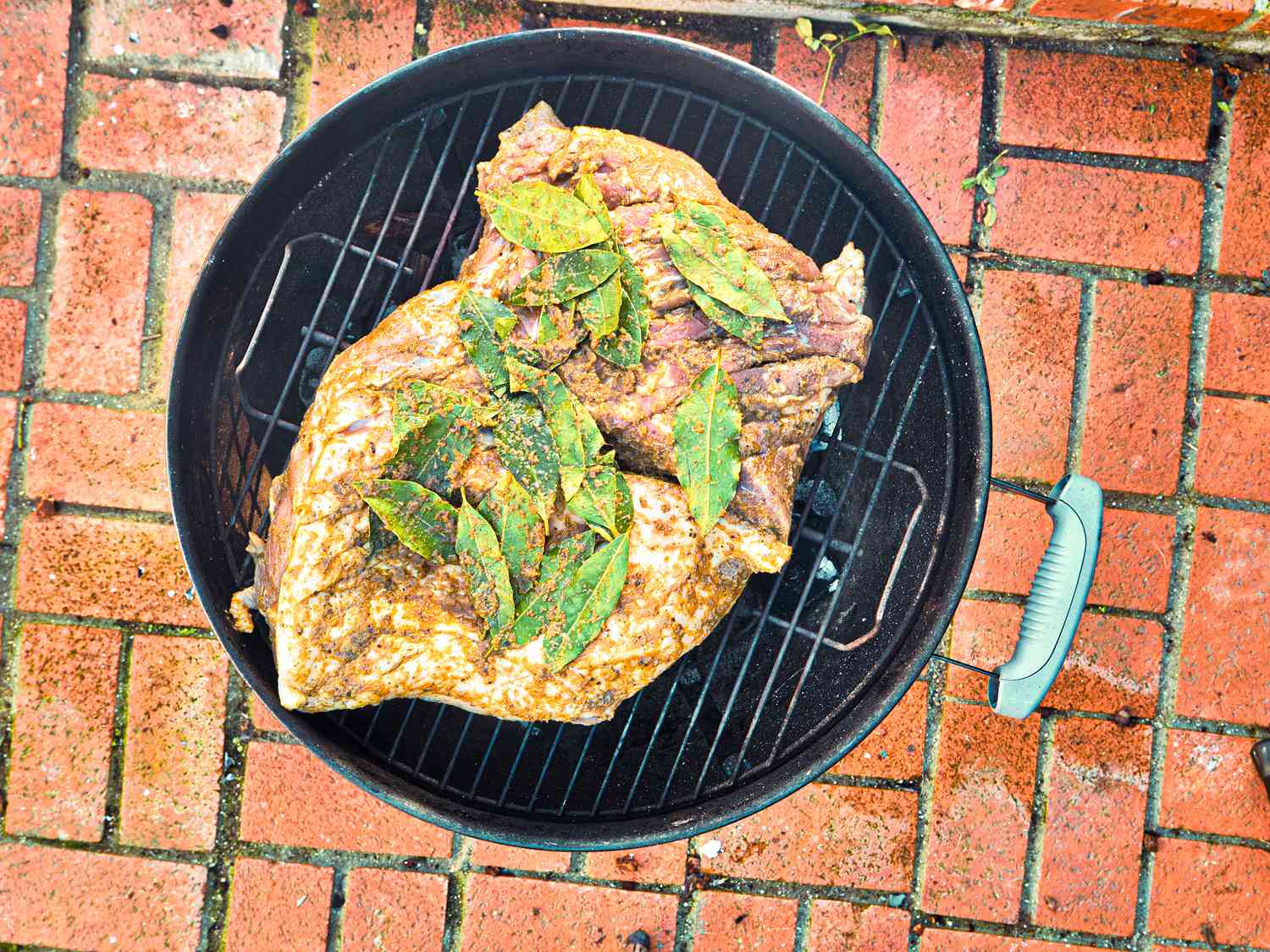 Overhead view of pork on charcoal grill