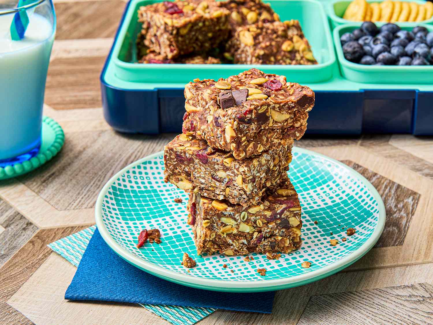Stack of homemade protein bars on a patterned plate