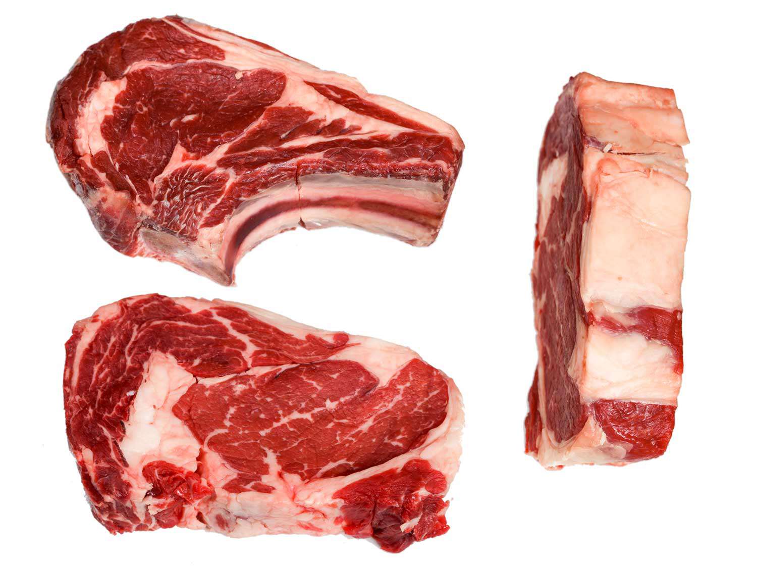 Three uncooked ribeye steaks