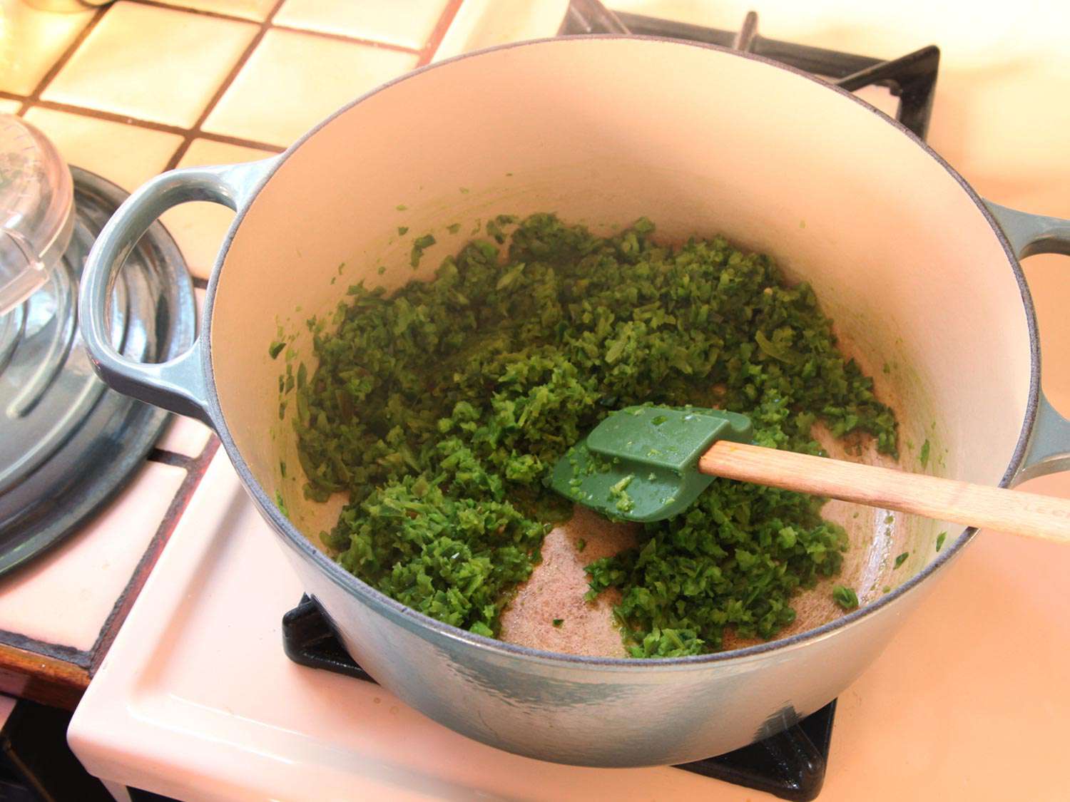 Sautéeing chiles in a Dutch oven.