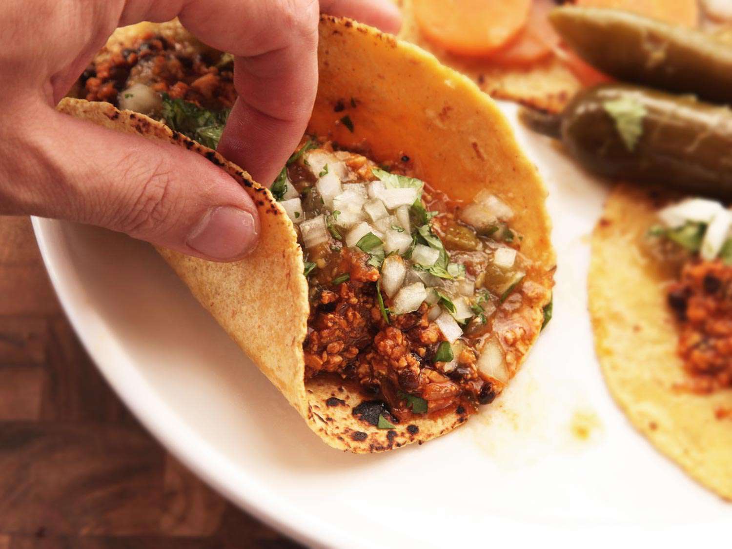 Author clutching a vegan chorizo taco.