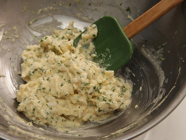 Crab cake mixture bound by a loose binder made from flour, eggs, and mayonnaise. 