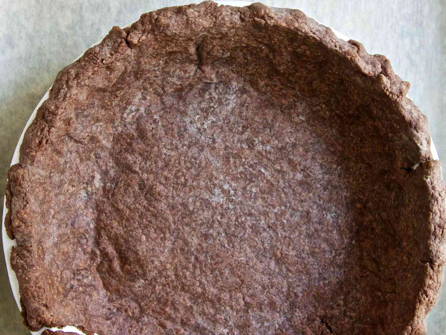 Top view of a baked chocolate pie crust. 