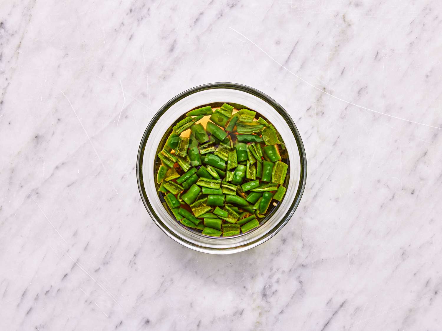 Overhead view of chiles in a jar