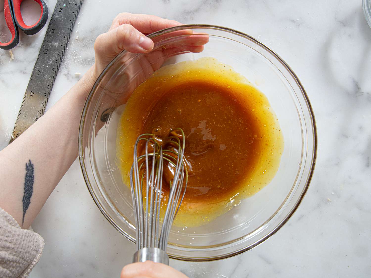 Overhead view of whisking glaze