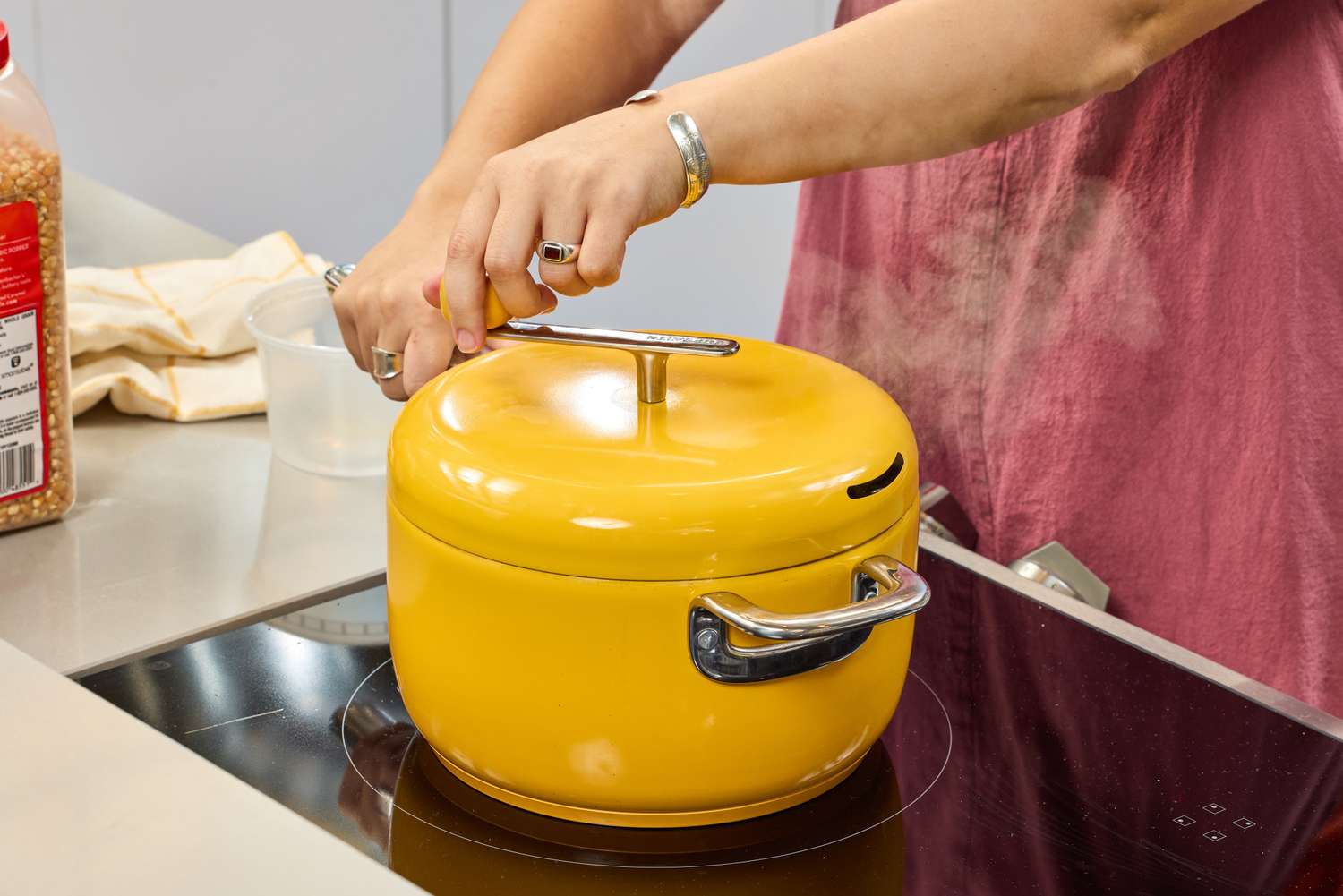 A person turns the crank on the top of the Popsmith The Popper