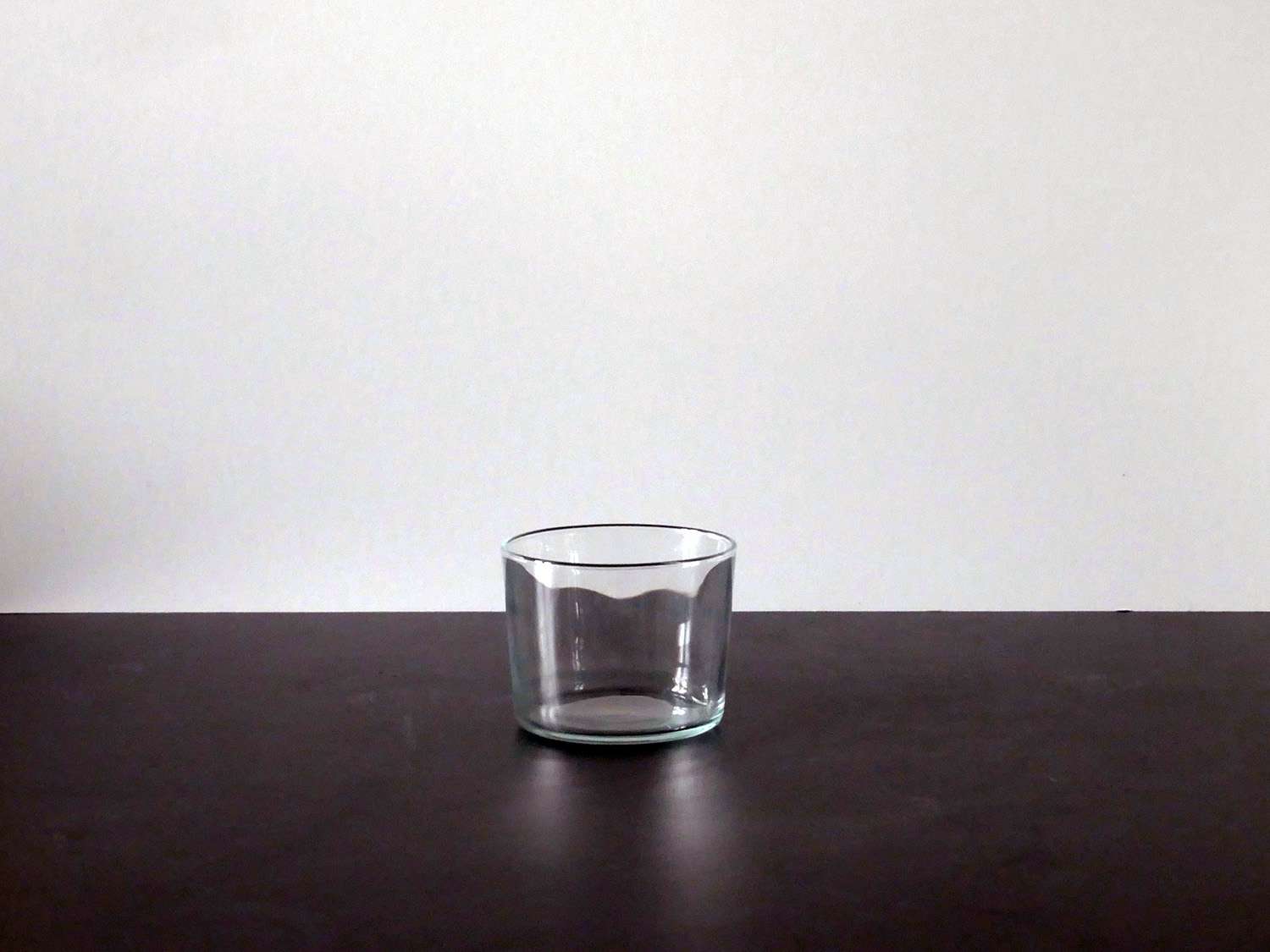 the bodega glass on a black countertop with white backdrop