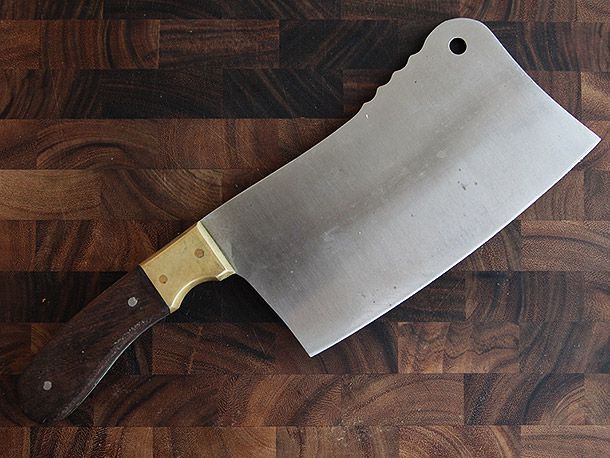 cleaver on wooden cutting board