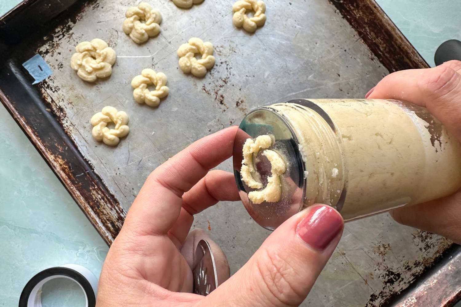 Hands holding the OXO Good Grips Cookie Press
