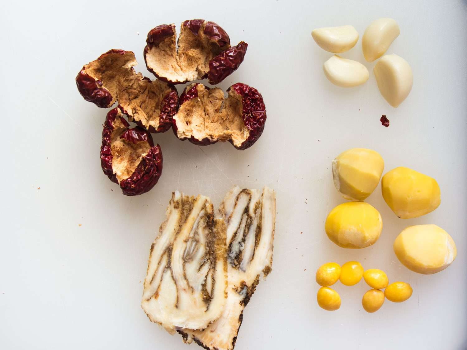 Some of the ingredients in Korean samgyetang: dried jujube, garlic, chestnuts, gingko, and ginseng.