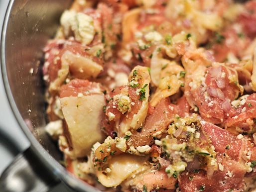 Closeup of the seasoned, cubed chicken, ready to chill.