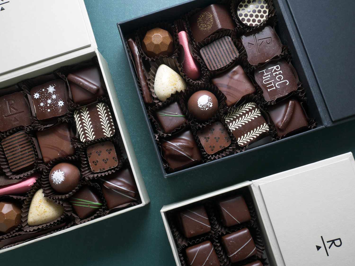 three boxes of ricchiutu chocolates opened