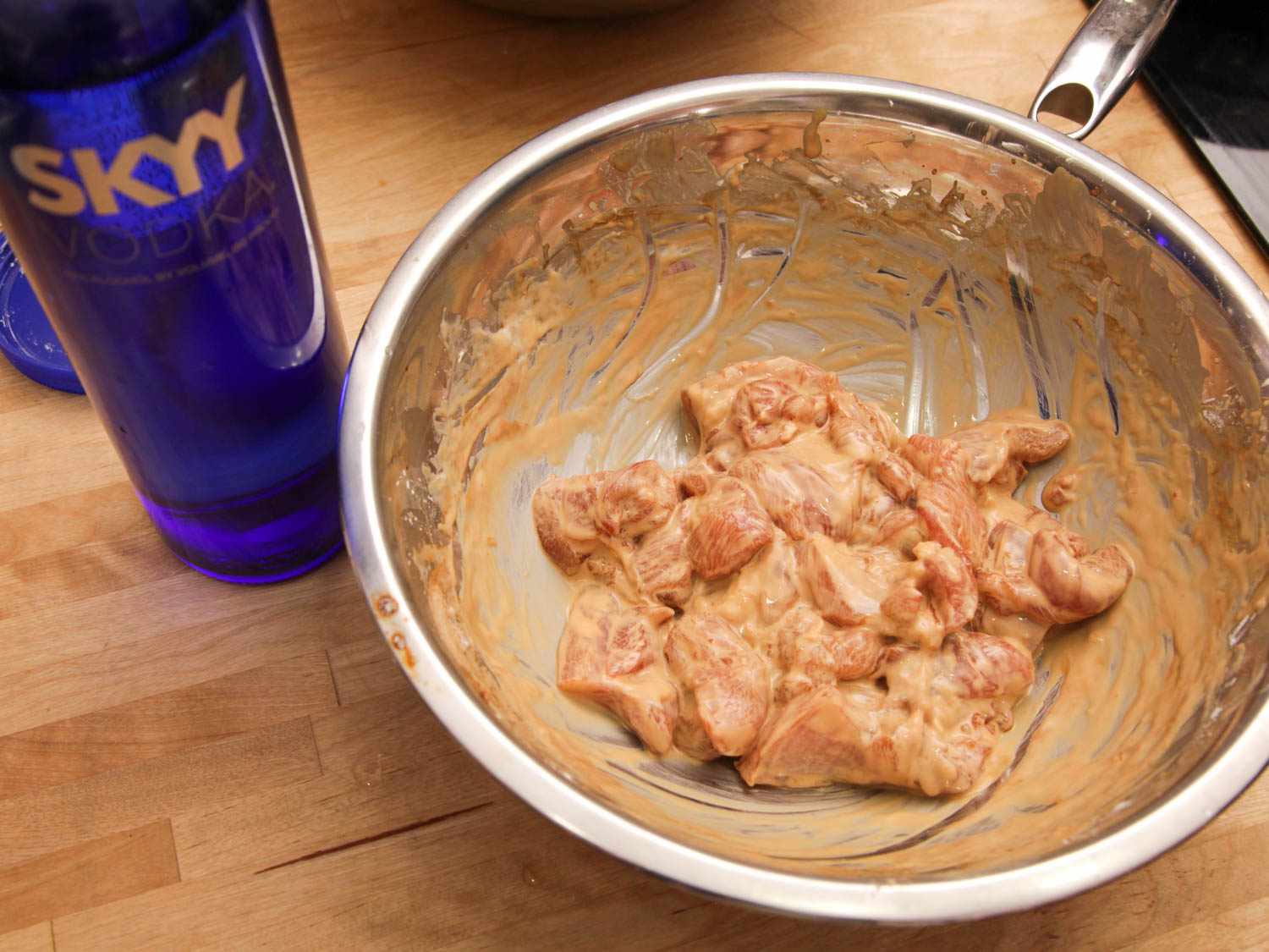 Boneless chicken thighs in a batter containing vodka.