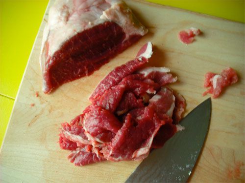 Slices of raw lamb leg for making Hunan lamb