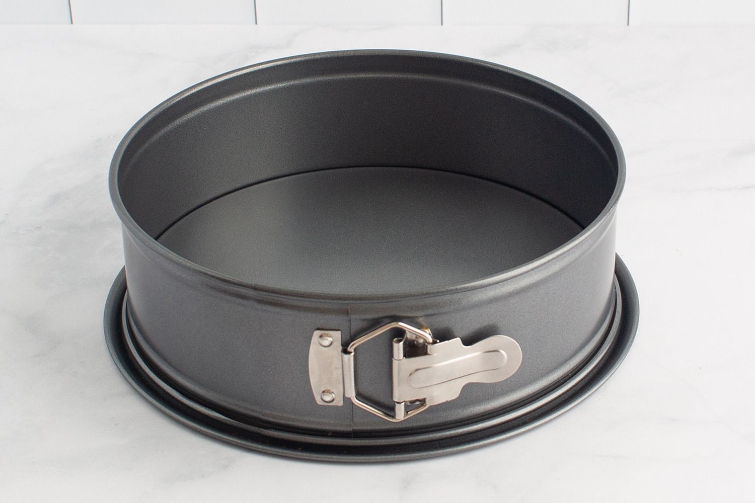 The NordicWare springform pan on a marble countertop.