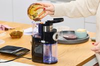 Person pouring coffee beans into Krups Precision Coffee Grinder