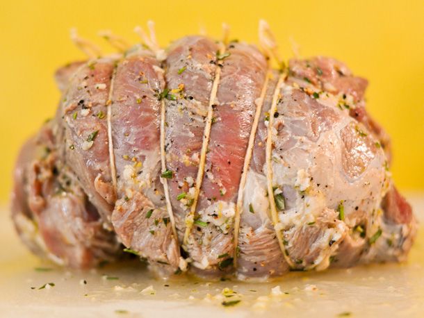 Closeup of the marinated and tied lamb leg roast.