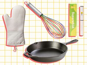 A collection of kitchen tools including a white oven mitt a black skillet a multicolored whisk and a packaging labeled Superwhisk