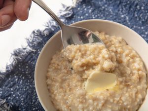 Bowl of instant pot oatmeal in a bowl with blue textile 