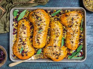 Overhead of hasselback butternut squash on a baking sheet