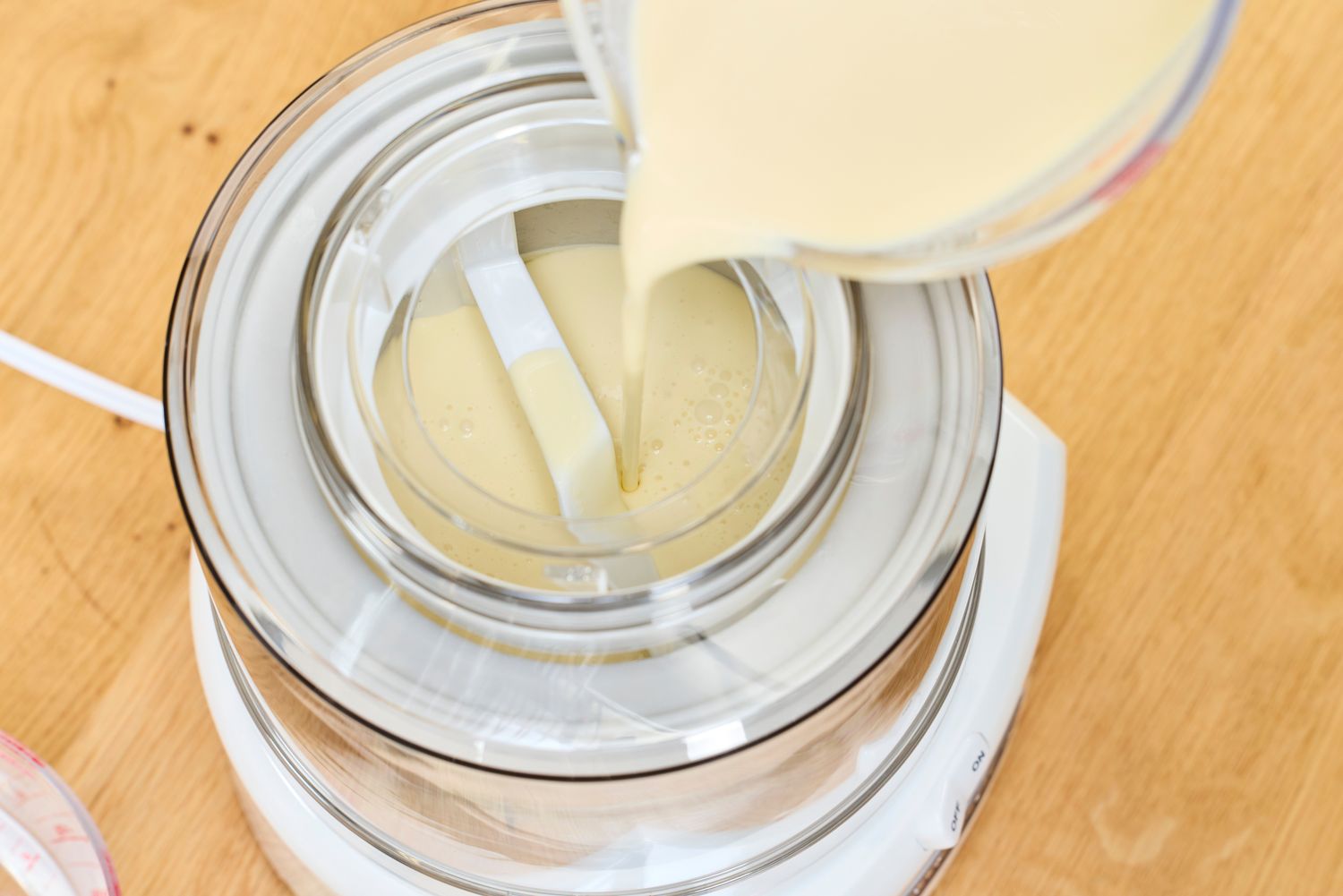 Liquid flowing into the Cuisinart 1.5-Quart Ice Cream Maker