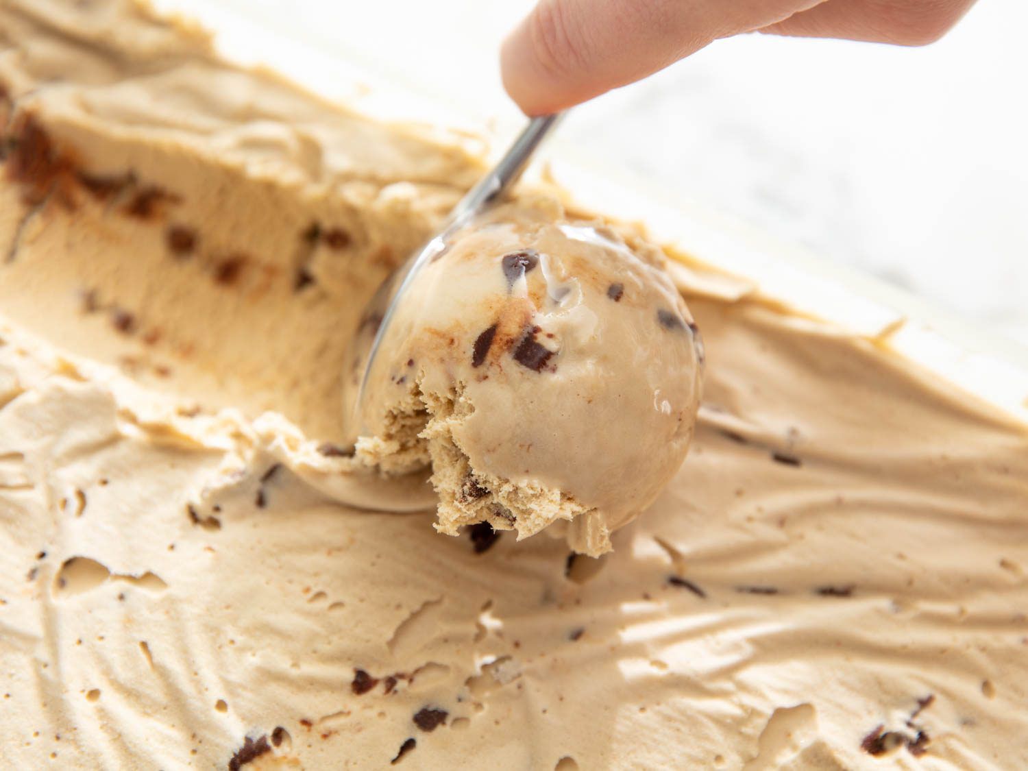 scooping Nutella-swirl ice cream