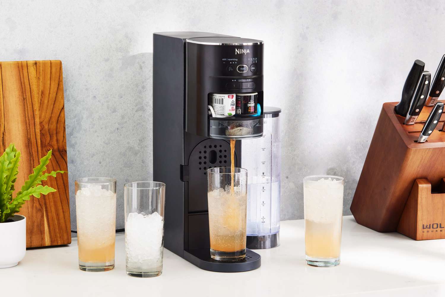 Ninja Thirsti Drink System dispensing drink into glass cups