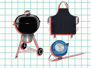 A grill an apron and a thermometer with a probe for grilling products