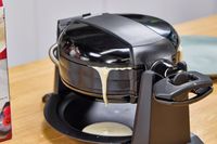 Batter drips from the Black+Decker Double Flip Rotating Waffle Maker