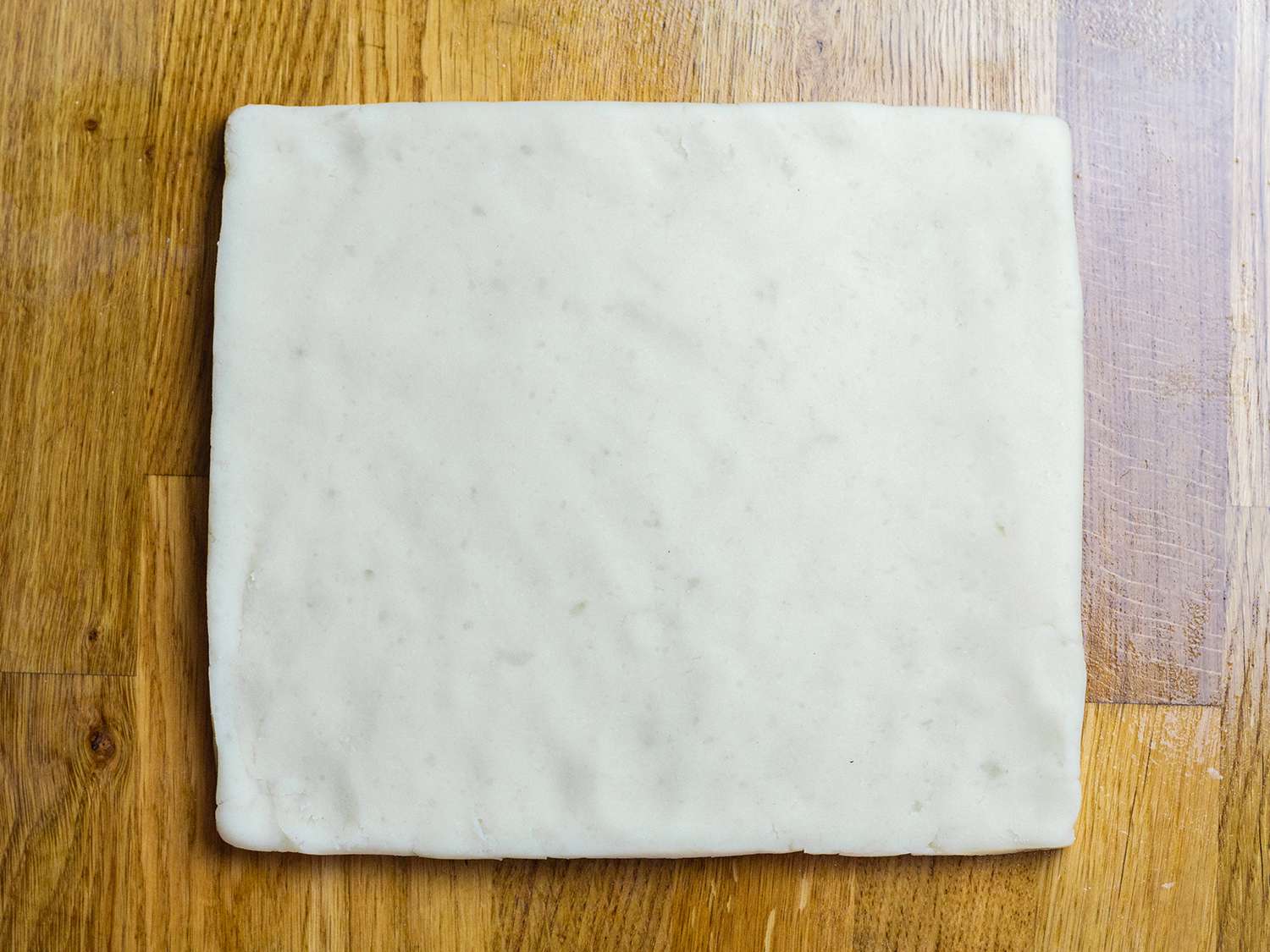 Squared off shaped dough on a work surface