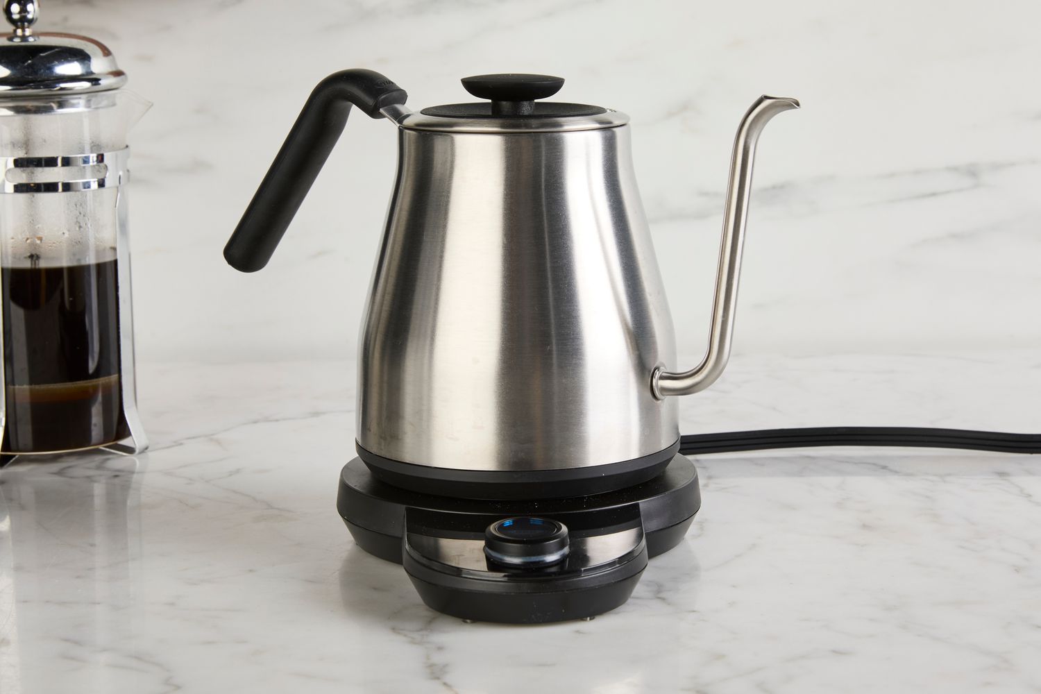 The OXO gooseneck kettle on a marble countertop.