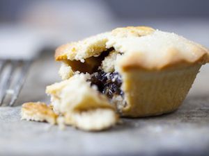A small mincemeat pie broken open.