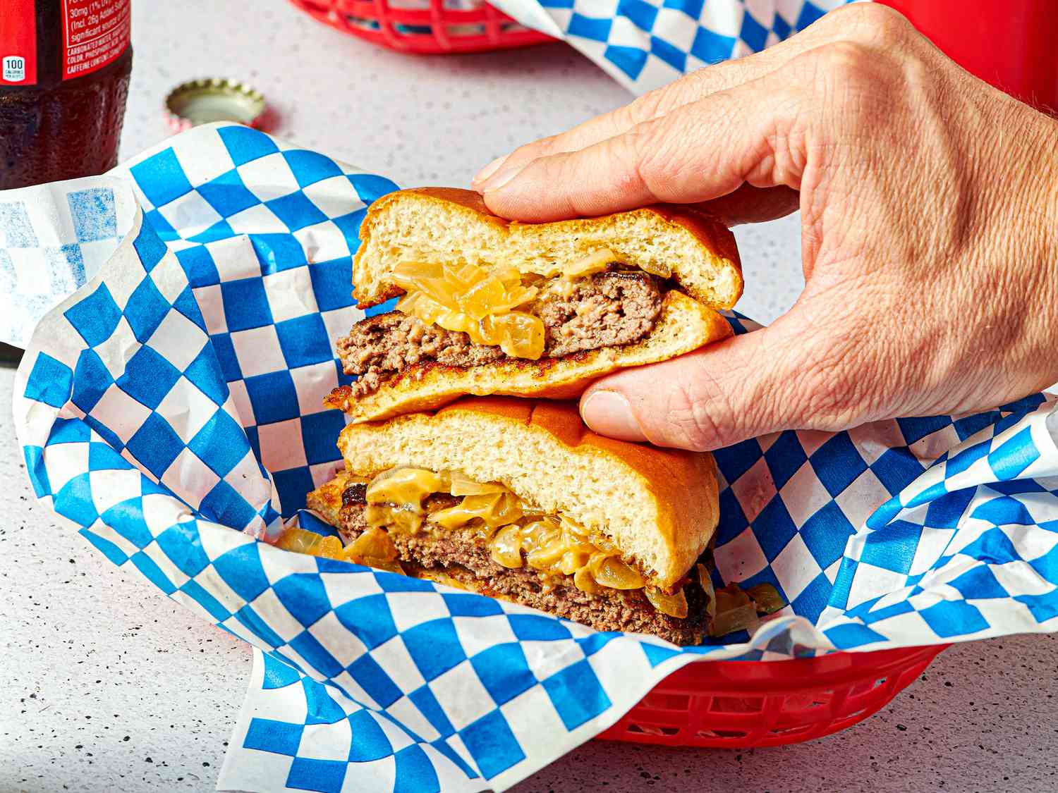 Side view of grabbing a burger