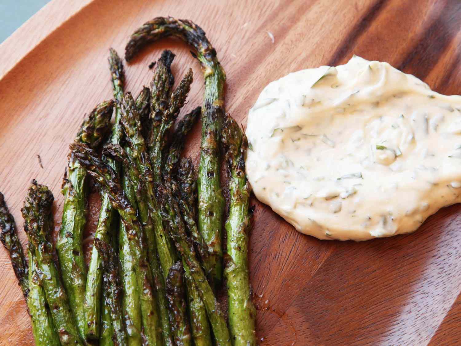 Grilled asparagus on a serving platter with tarragon-lemon aioli.