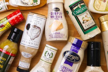 A table full of various Caesar dressings 